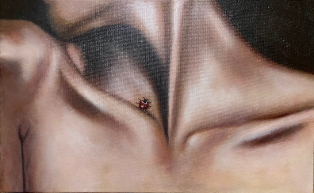 A painting of a person's chest with a ladybug on their inner skin.
